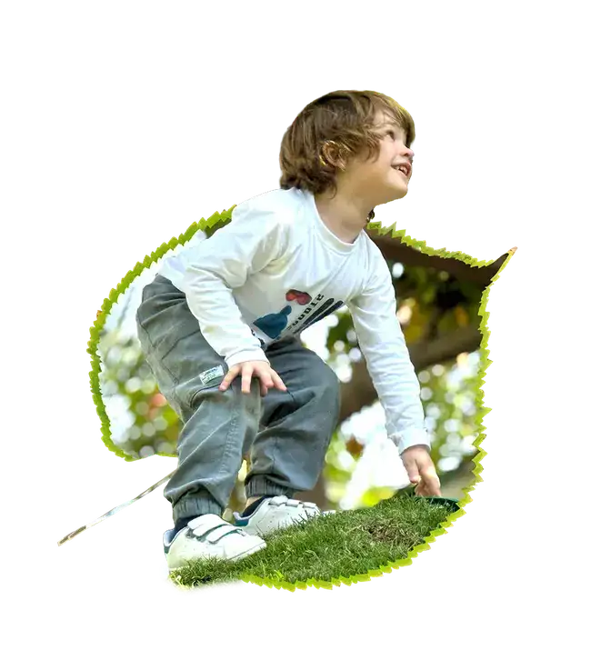 Child sitting in a leaf frame
